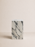 Luxury white marble with grey veining pattern rectangular block on a off white studio background