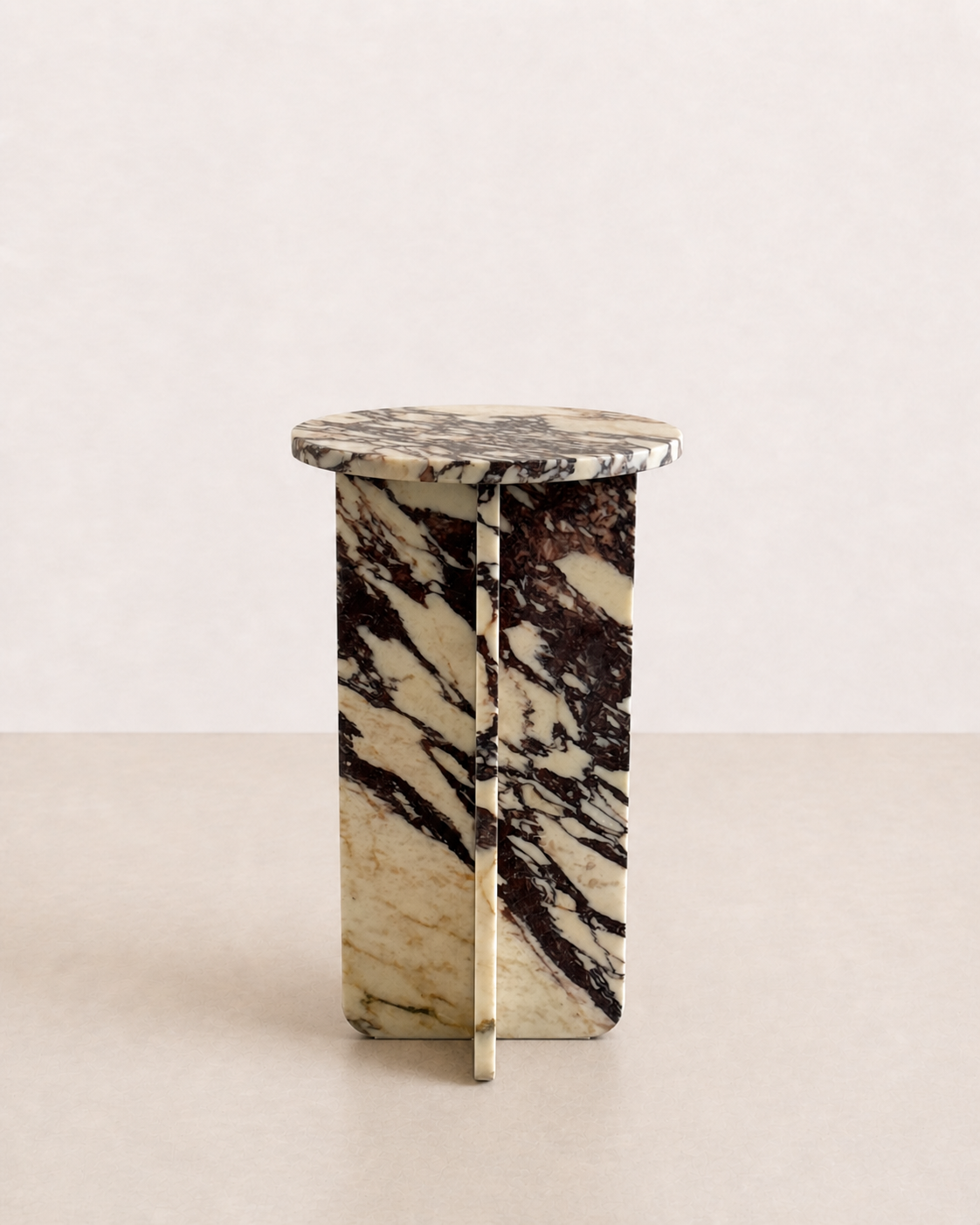 Luxury cream marble with deep violet veining pattern round side table in a off white studio background. Front view.